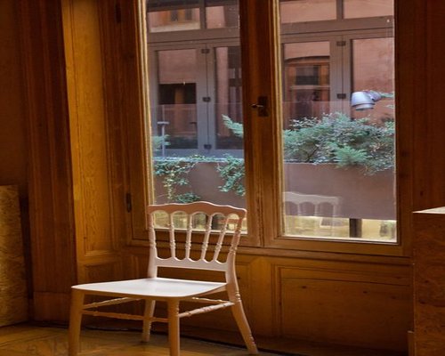 Italian apartment interior showing soft natural daylight from a large window